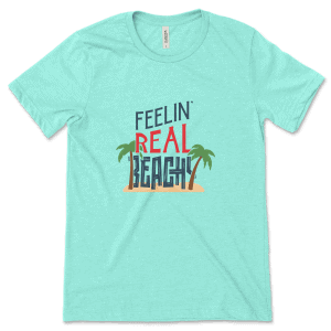 Product mockup of the funny, travel-inspired Feelin' Real Beachy print by Relateeble on a mint colored unisex/men's short sleeve tee