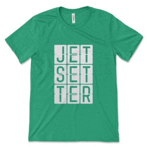 Product mockup of the relatable, travel-inspired Jetsetter print by Relateeble on a kelly colored unisex/men's short sleeve tee