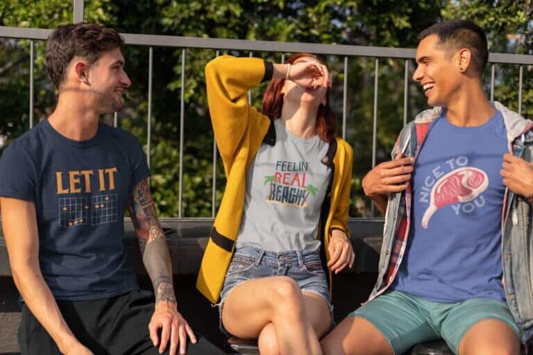 Lifestyle mockup of 3 friends sporting funny and witty graphic t-shirts by Relateeble.